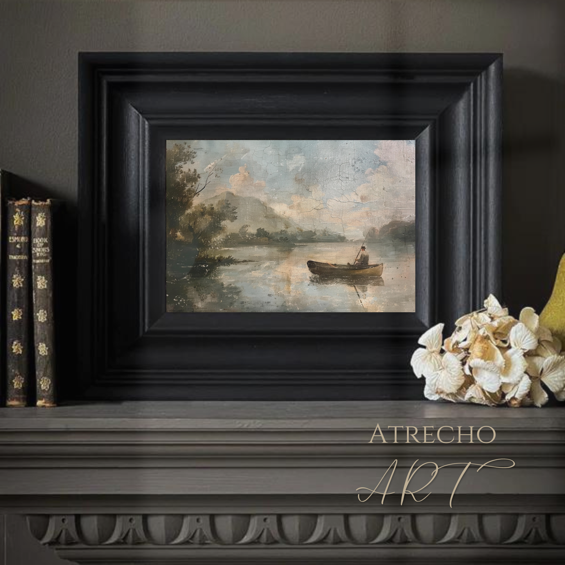 Vintage lake fisherman print above a wooden desk with books and brass lamp — calm Old World study vignette