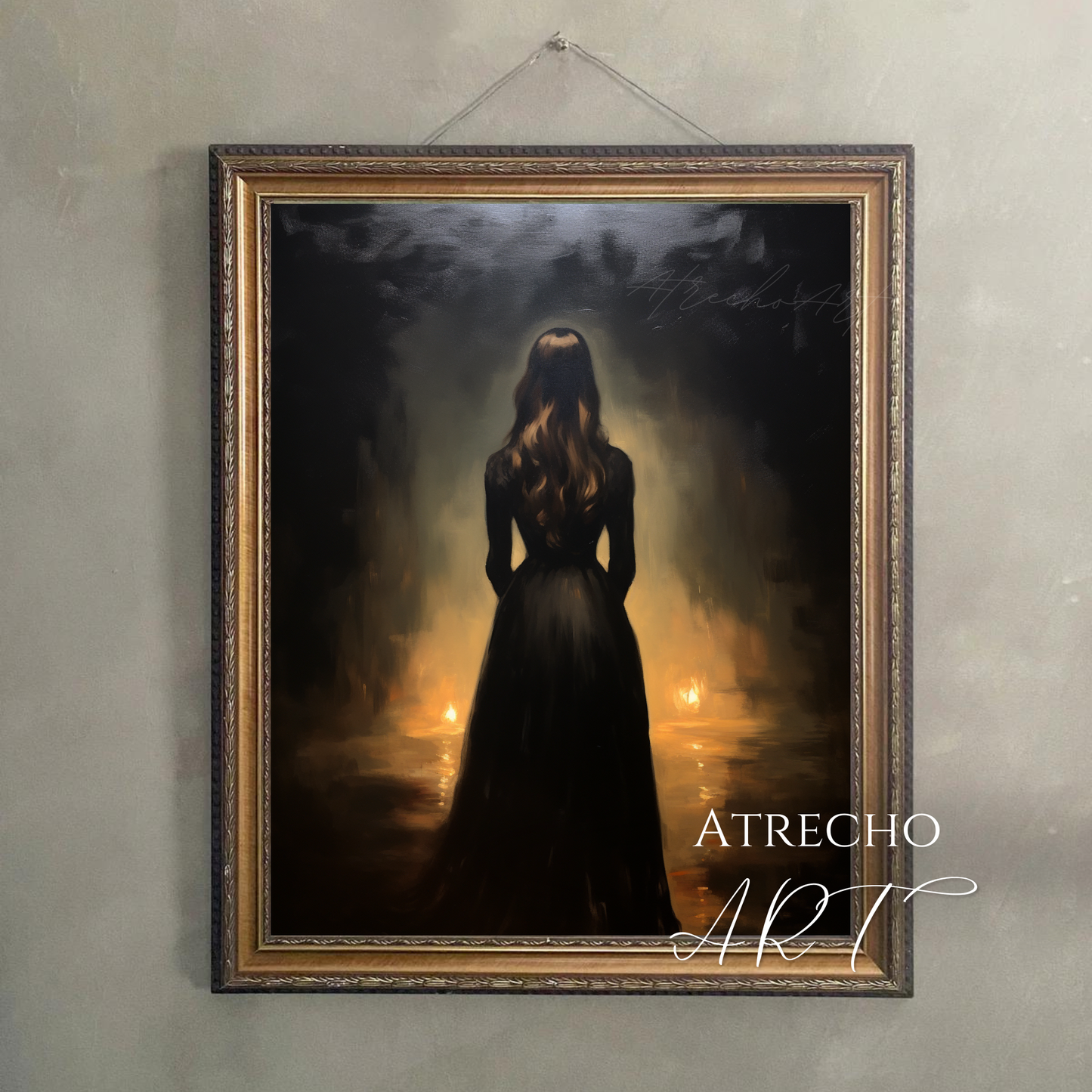 Large vertical art print of a silhouetted woman in candlelight hung above a dark velvet reading chair