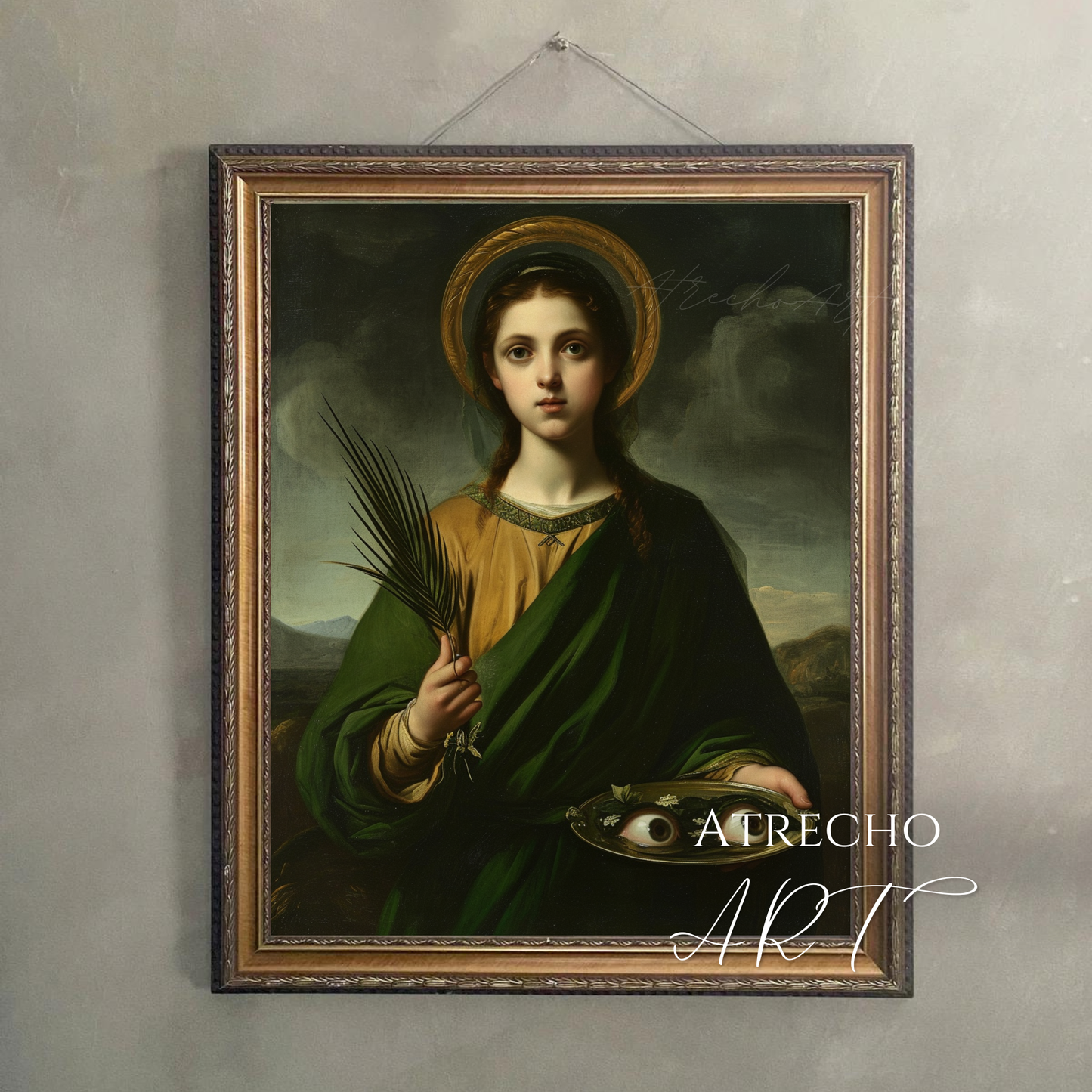 Saint Lucia art print hanging on grey plaster wall in warm wood frame — cord-hung Catholic saint wall art, RE21 by Atrecho Art
